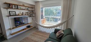 TV/trung tâm giải trí tại Apartamento Areia Branca