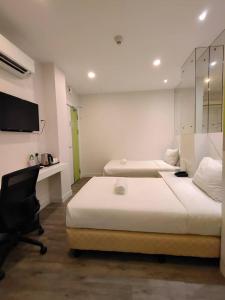 Postel nebo postele na pokoji v ubytování CAPITAL EXPRESS + 17 fotografií