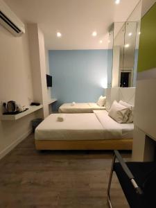 Postel nebo postele na pokoji v ubytování CAPITAL EXPRESS