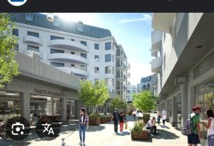 Uma representação de uma rua com pessoas caminhando em frente a prédios. em chambre - Paris - salons & missions pro em Montrouge