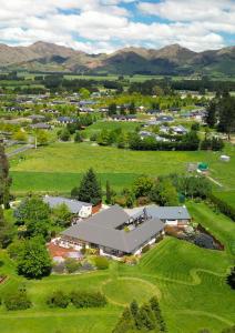 an overhead view of a large building in a field at Vibrant Living Retreat in Hanmer Springs +26 photos