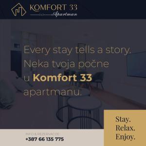 Un cartel de una habitación con una mesa y sillas. en Apartman KOMFORT 33, en Donje Mladice