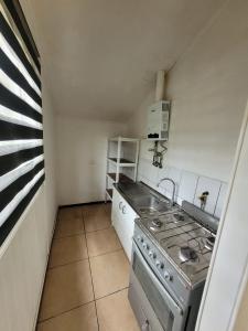 Køkken eller tekøkken på Cabaña Bosques de Santa Elvira