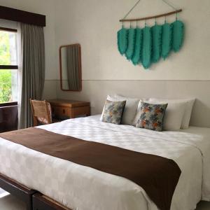 Postel nebo postele na pokoji v ubytování Maha di Nusa Lembongan + 56 fotografií