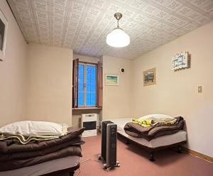 En eller flere senge i et værelse på 蔵王ペンションKomorebi