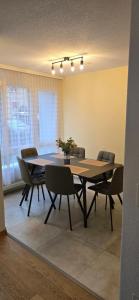 a dining room with a table and chairs at Appartement cosy a Erlach - Lac de Bienne in Erlach