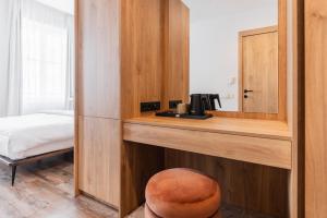 En eller flere senge i et værelse på FortyPlusOne Hotel Vienna