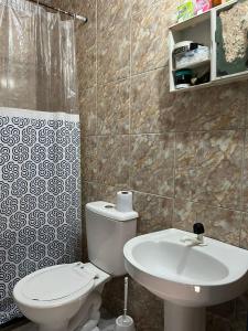 a bathroom with a toilet and a sink at CANTINHO do SILENCIO in Morro de São Paulo +9 photos