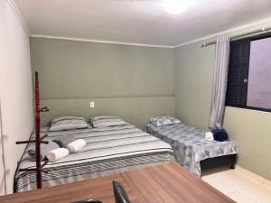 Giường trong phòng chung tại Refúgio premium p até 4 Perto do centro