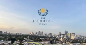 a city skyline with the guided blue nest logo at The Gilded Blue Nest in Mandaue City