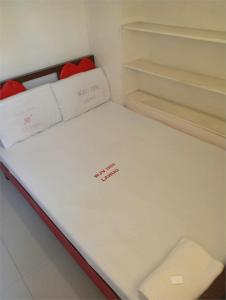 Кровать или кровати в номере WJV INN LAHUG