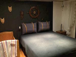 En eller flere senge i et værelse på 6 person holiday home in Thyholm