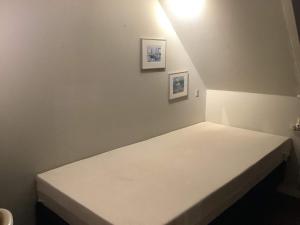 En eller flere senge i et værelse på 6 person holiday home in Thyholm