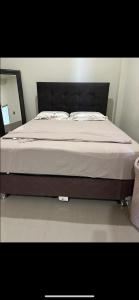 Giường trong phòng chung tại Casa Moderna Premium con Aire Acondicionado y Cine