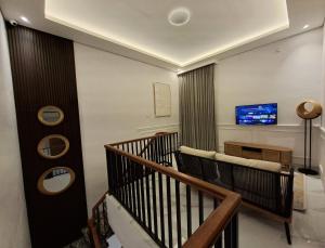 TV a/nebo společenská místnost v ubytování Rumaé Rukun + 10 fotografií