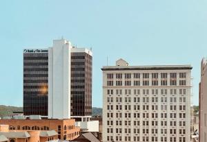 a city skyline with two tall buildings at Lynchburg Grand Essential by IHG in Lynchburg