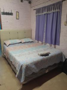 Giường trong phòng chung tại El Rincón del Capibara Alojamientos