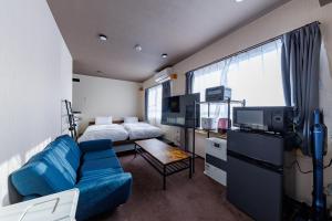 TV a/nebo společenská místnost v ubytování Maison Odori