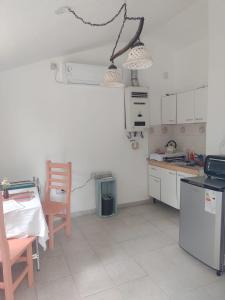 Kuchyň nebo kuchyňský kout v ubytování La Calma