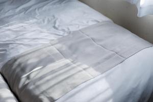 Giường trong phòng chung tại Maison Odori