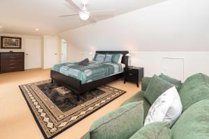 a living room with a couch and a bed at Cascade View - 4 Bedroom House in Cascade +29 photos