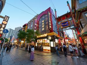 a group of people standing on a street in a city at RetroSpect Stay Yokohama - Vacation STAY 93126v in Yokohama