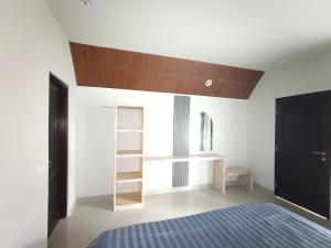 En eller flere senge i et værelse på GHangga Amed