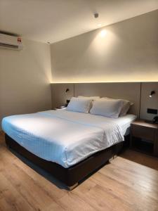 Ένα ή περισσότερα κρεβάτια σε δωμάτιο στο The Imperial Hotel