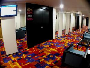 TV o dispositivi per l'intrattenimento presso Harbour View Hotel