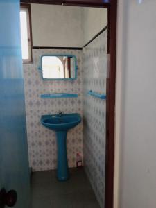 a bathroom with a blue sink and a mirror at Gin River View Point in Gintota +46 photos