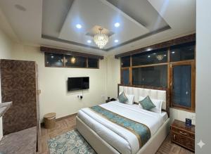 Ένα ή περισσότερα κρεβάτια σε δωμάτιο στο Hotel oscar Mountain Retreat