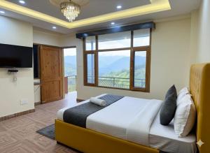 Ένα ή περισσότερα κρεβάτια σε δωμάτιο στο Hotel oscar Mountain Retreat