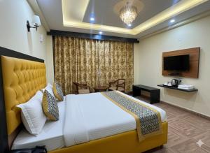 Μια τηλεόραση ή/και κέντρο ψυχαγωγίας στο Hotel oscar Mountain Retreat