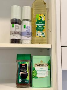 a shelf with food items in a pantry at Stunning Harbour Bridge Views Apartment in Sydney