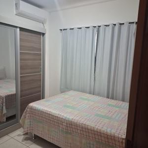 Postel nebo postele na pokoji v ubytování Apartamento Charmoso no térreo