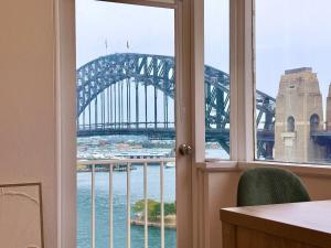 a view of the sydney harbour bridge from a window at Stunning Harbour Bridge Views Apartment in Sydney