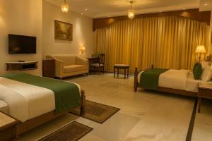 Ένα ή περισσότερα κρεβάτια σε δωμάτιο στο Shastri Lodge