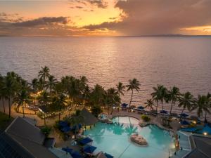 a view of the ocean from the resort at sunset at DoubleTree by Hilton Fiji - Sonaisali Island in Nadi