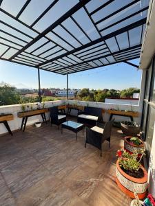 Un balcón o terraza en Hermosa residencia en San Pedro Cholula 10 fotos más