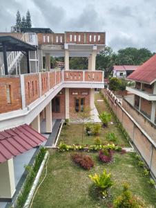 an aerial view of a building with a garden at SADAMA Cottage in Tuk Tuk