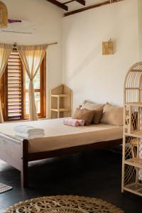 a bedroom with a bed in a room at Slow Life Boutique Hotel - Adults Only in Mirissa +103 photos