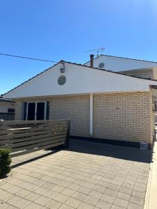 a brick building with a fence in front of it at 80 Tarcutta St in Wagga Wagga