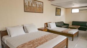 En eller flere senge i et værelse på Mahajaya Hotel Denpasar + 18 billeder