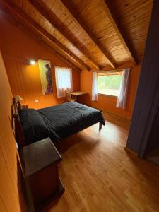 En eller flere senge i et værelse på Cabañas 4 Estaciones