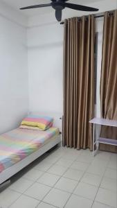 Una cama o camas en una habitación de Homestay PPAM Dalur Apartment Presint 18,Putrajaya