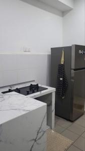 Una cocina o cocineta en Homestay PPAM Dalur Apartment Presint 18,Putrajaya