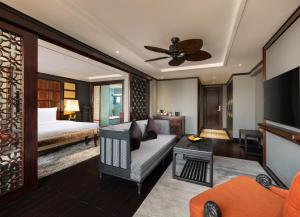 a living room with a couch and a bed at Hanoi Solis Hotel in Hanoi
