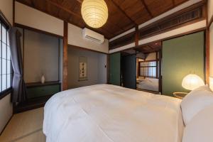 Postel nebo postele na pokoji v ubytování SAKON UKON