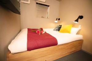 Postel nebo postele na pokoji v ubytování boxi Hakata 2 + 35 fotografií