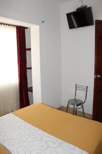 TV a/nebo společenská místnost v ubytování Hotel Abadia